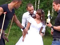 A Russian bride experiences a wild group sex with multiple men outdoors